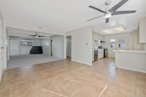 a view of a big room with closet and windows