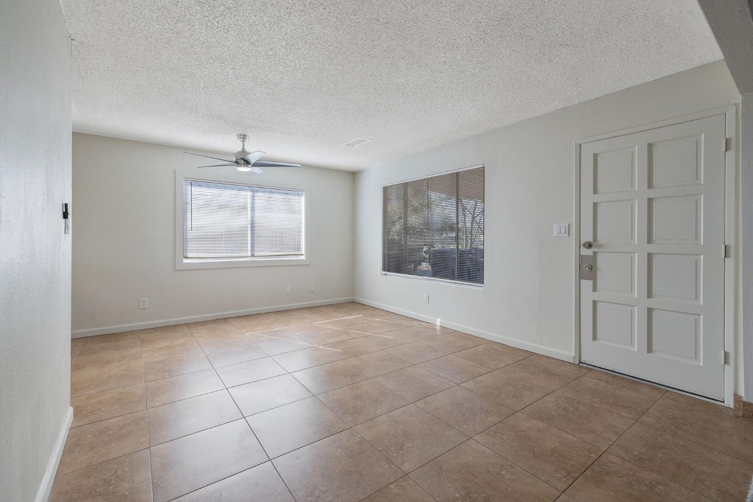 1432 North Locust Street Visalia, CA 93291 - Photo 7 of 37 a view of an empty room with a window