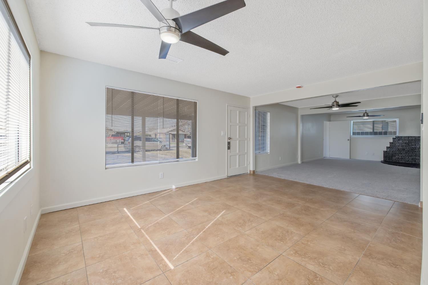 1432 North Locust Street Visalia, CA 93291 - Photo 9 of 37 a view of an empty room with a window