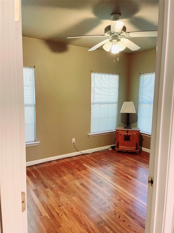 1131 Ebert Avenue Austin, TX 78721 - Photo 11 of 12 a bedroom with a bed and a chandelier