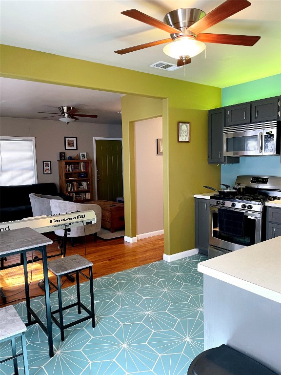 1131 Ebert Avenue Austin, TX 78721 - Photo 3 of 12 a living room with stainless steel appliances lots of furniture and chandelier