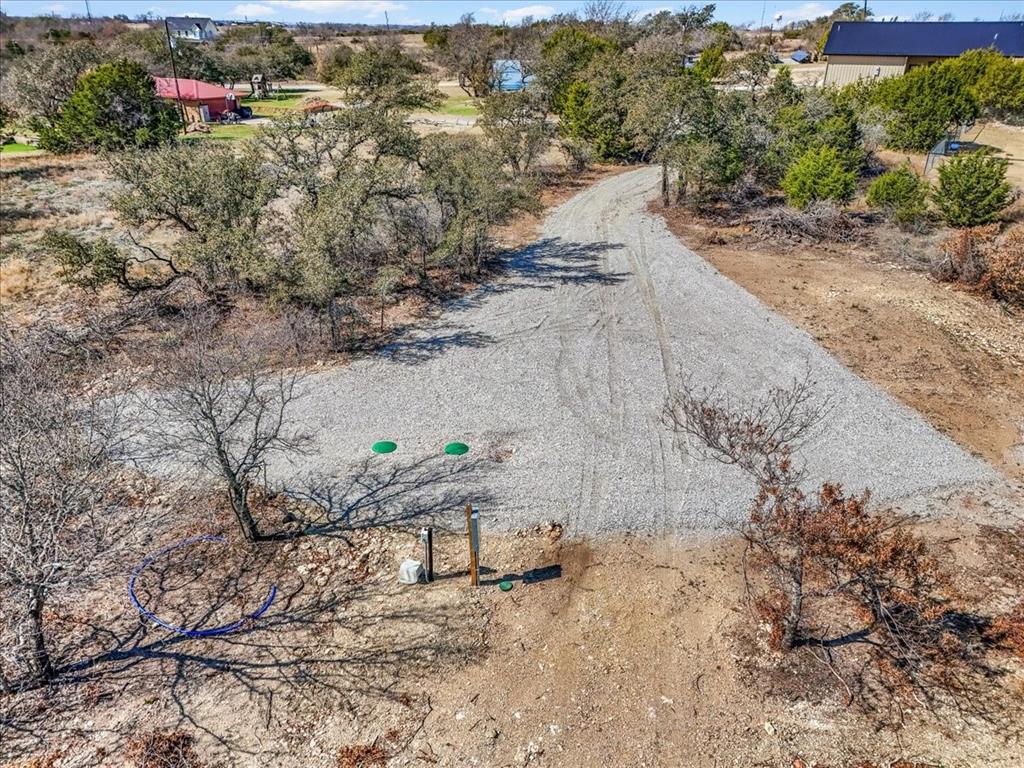 112 Valley View Court Springtown, TX 76082 - Photo 4 of 10 View of cleared area showing septic, water and utilities