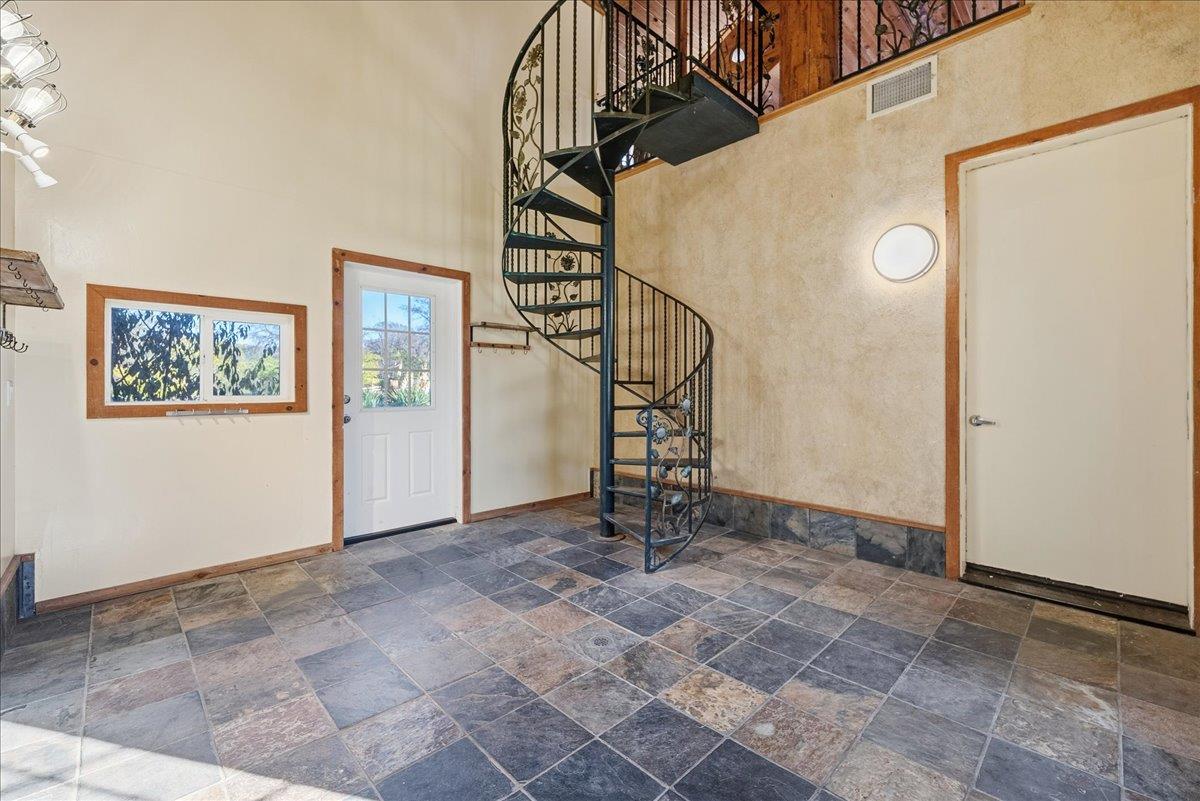 4053 Wilson Town Road Lincoln, CA 95648 - Photo 31 of 87 The mudroom connects the three stall garage to the main home. These stairs lead to the huge loft with full bath above the garage.