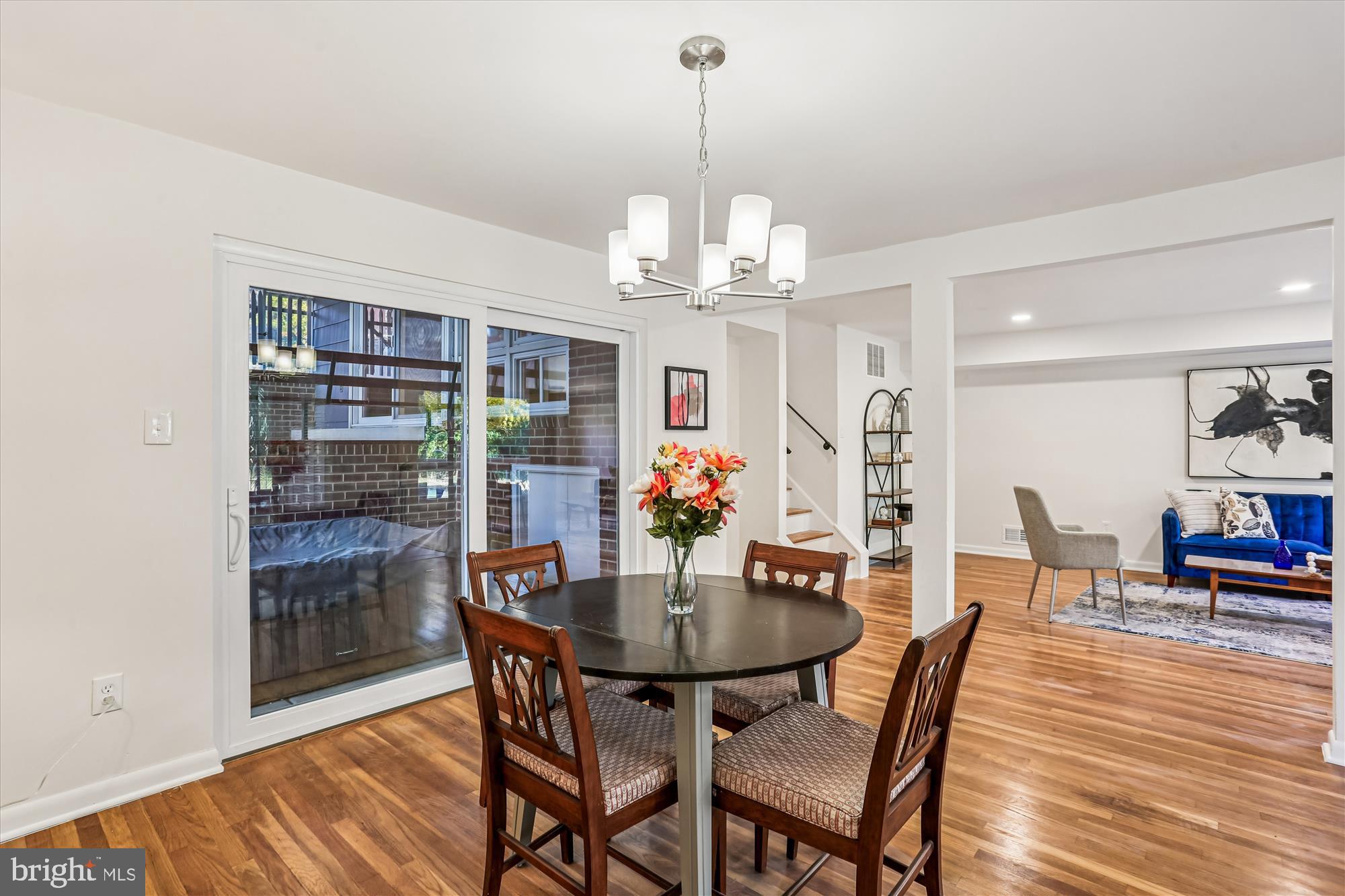 420 Lamberton Drive Silver Spring, MD 20902 - Photo 11 of 46 a view of a dining room with furniture wooden floor and chandelier