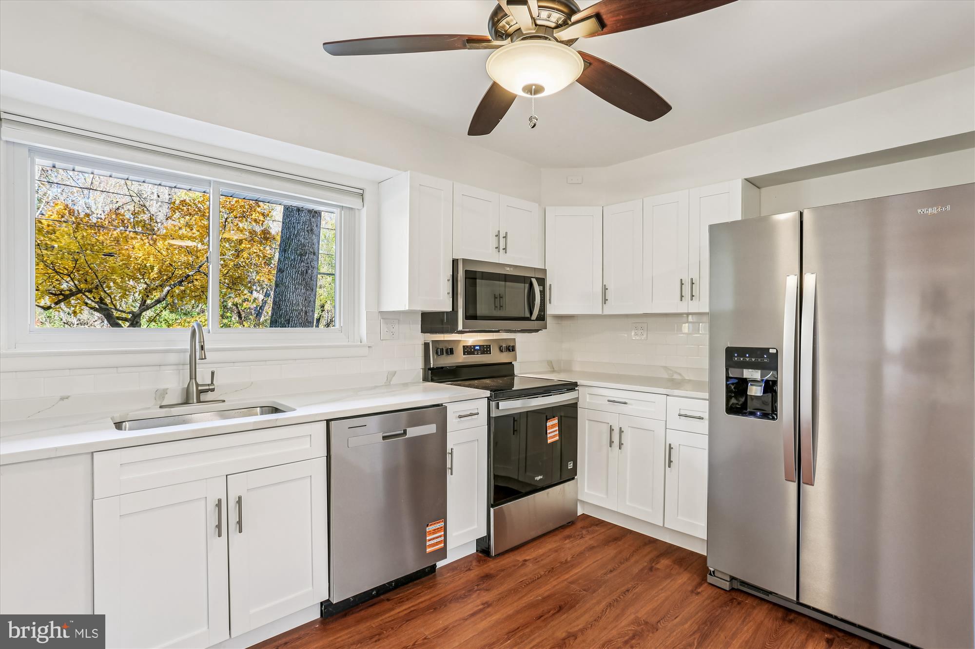 420 Lamberton Drive Silver Spring, MD 20902 - Photo 13 of 46 a kitchen with a sink stainless steel appliances and window