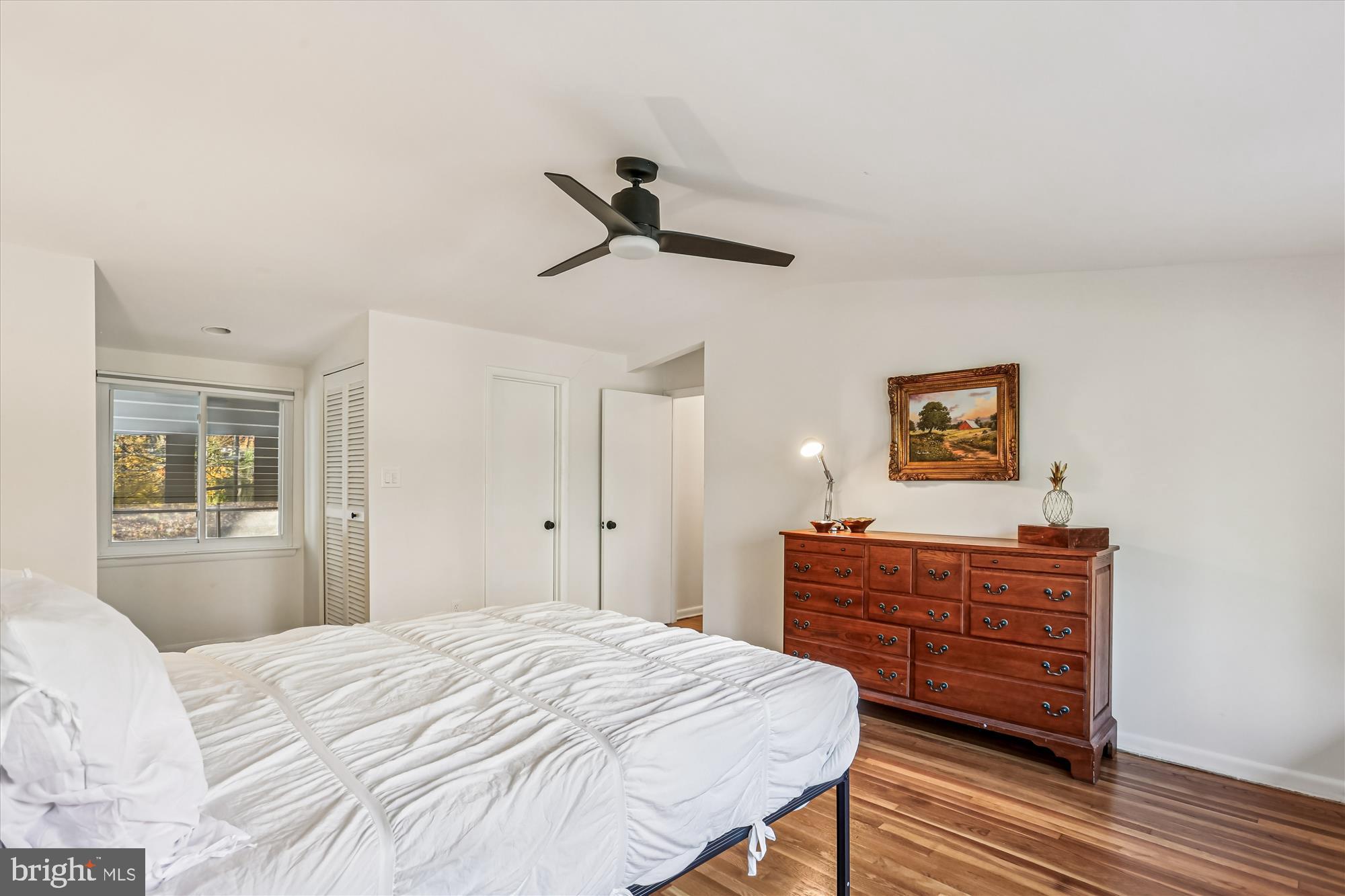 420 Lamberton Drive Silver Spring, MD 20902 - Photo 26 of 46 a bedroom with a bed and wooden floor