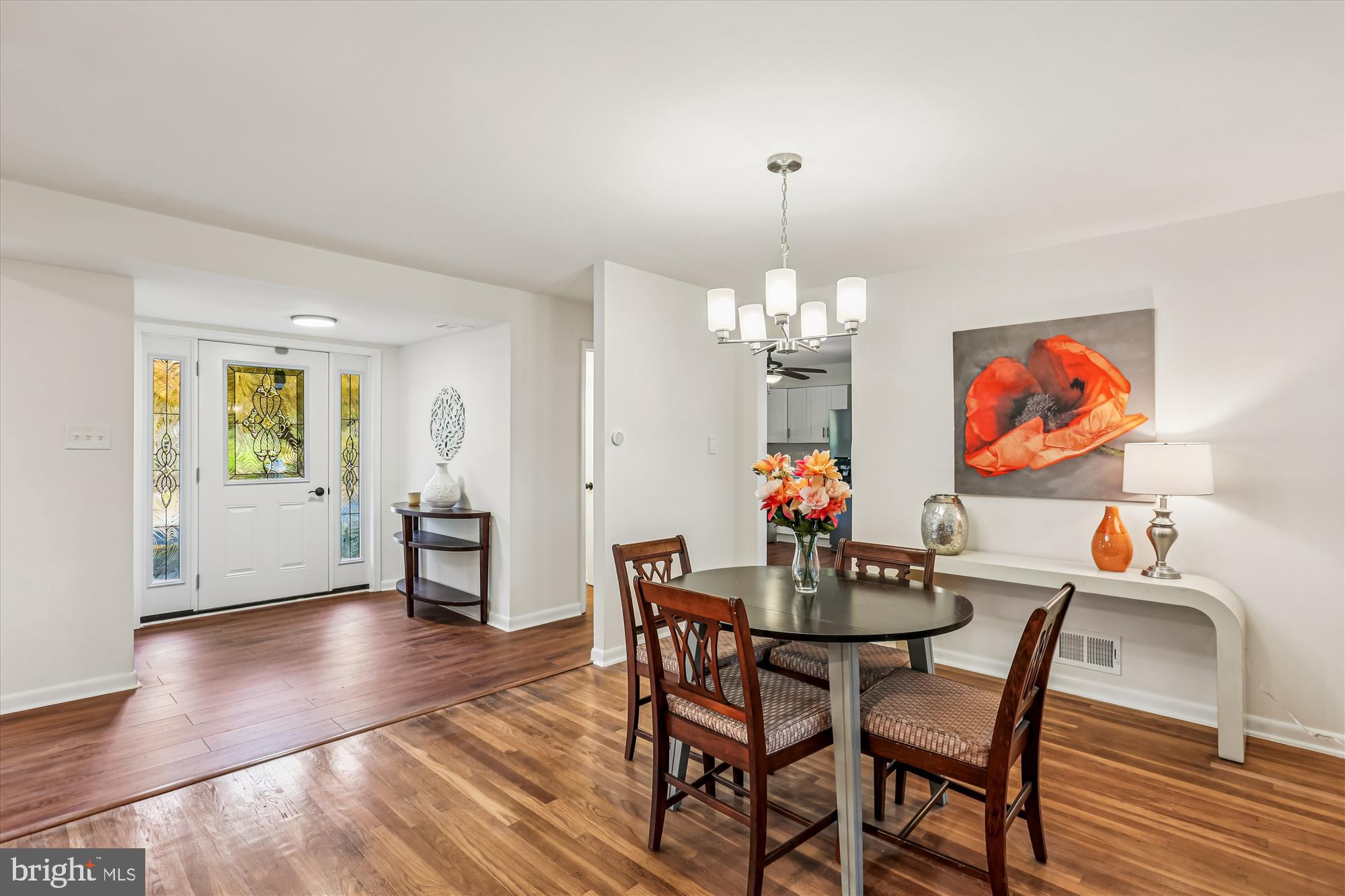 420 Lamberton Drive Silver Spring, MD 20902 - Photo 9 of 46 a view of a dining room with furniture wooden floor and chandelier