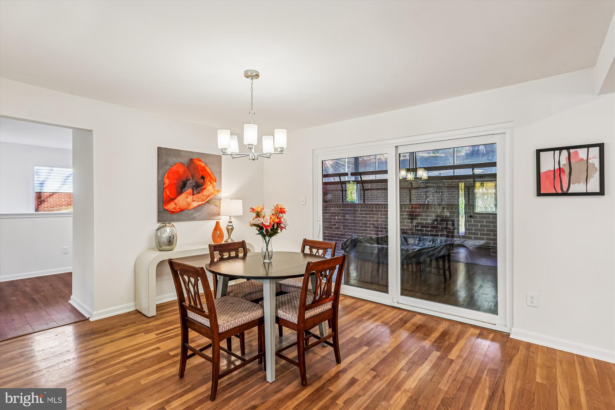 420 Lamberton Drive Silver Spring, MD 20902 - Photo 10 of 46 a view of a dining room with furniture wooden floor and chandelier