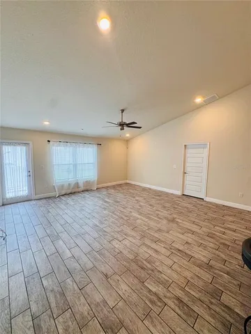 a kitchen with stainless steel appliances kitchen island granite countertop a sink and a microwave