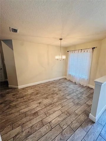 a bathroom with a granite countertop sink mirror vanity and toilet