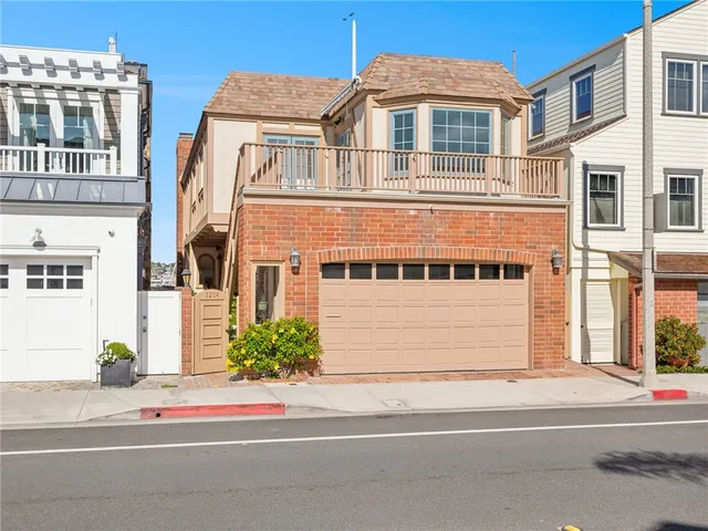 a living room with furniture a fireplace and a floor to ceiling window