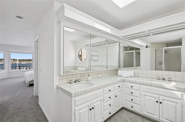 a spacious bedroom with a bed and a large window