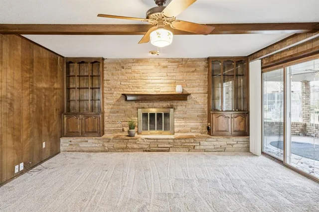a view of a livingroom with a chandelier and fireplace
