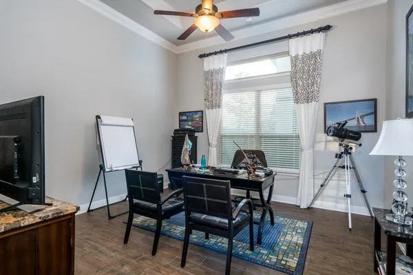a dining room with furniture and window