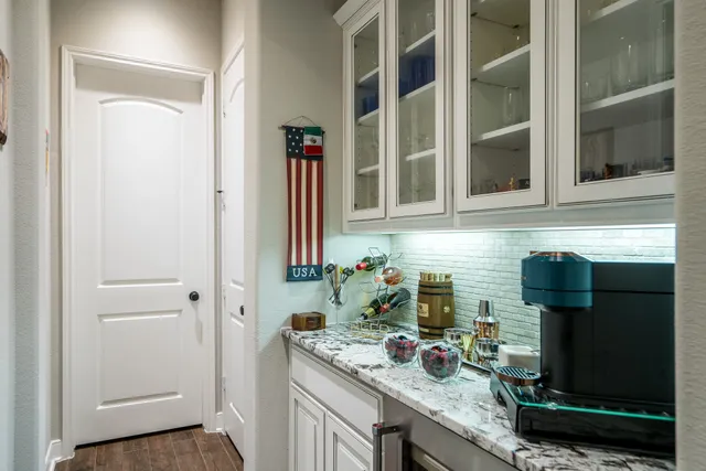 a kitchen with a sink and cabinets