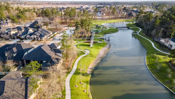 an aerial view of a house with a swimming pool