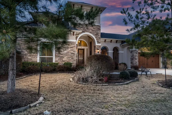 a front view of a house with garden