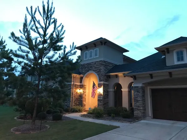a house view with a garden space