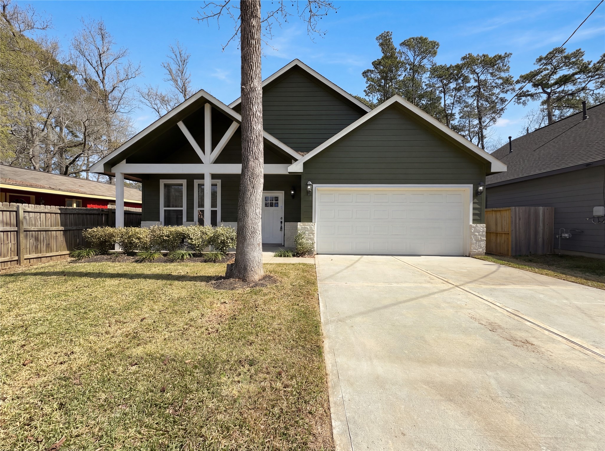 15376 Coaltown Road Willis, TX 77378 - Photo 1 of 17 a front view of a house with garden