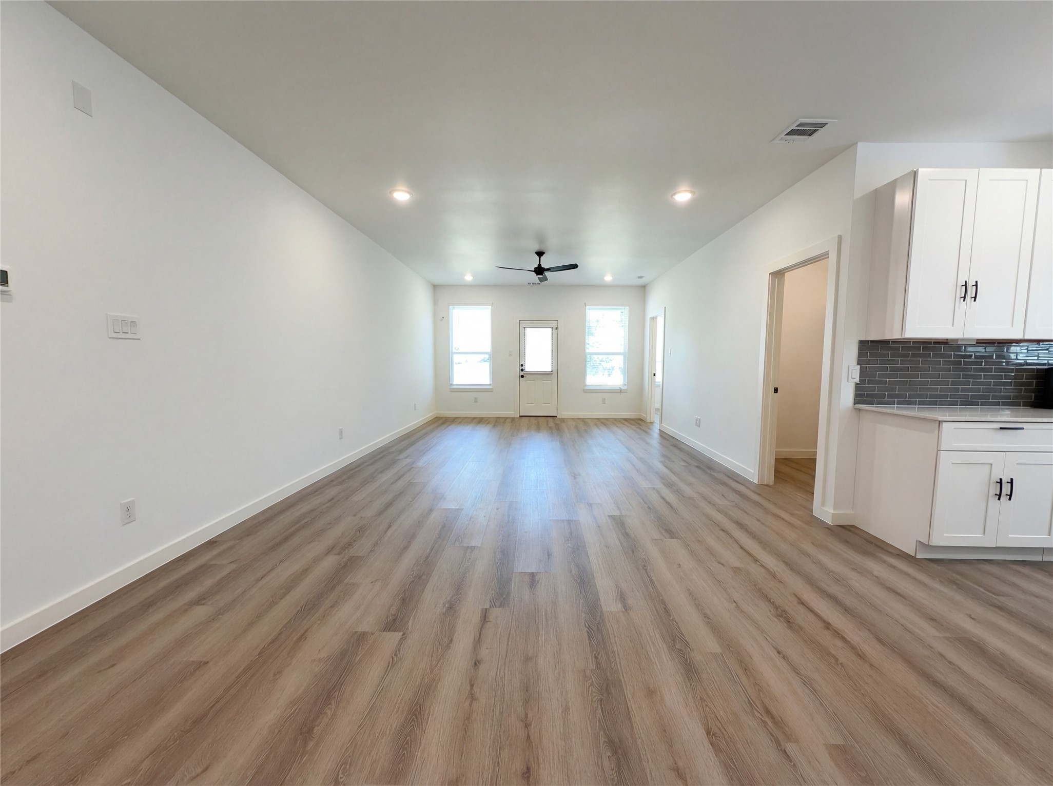 15376 Coaltown Road Willis, TX 77378 - Photo 3 of 17 a view of an empty room and wooden floor