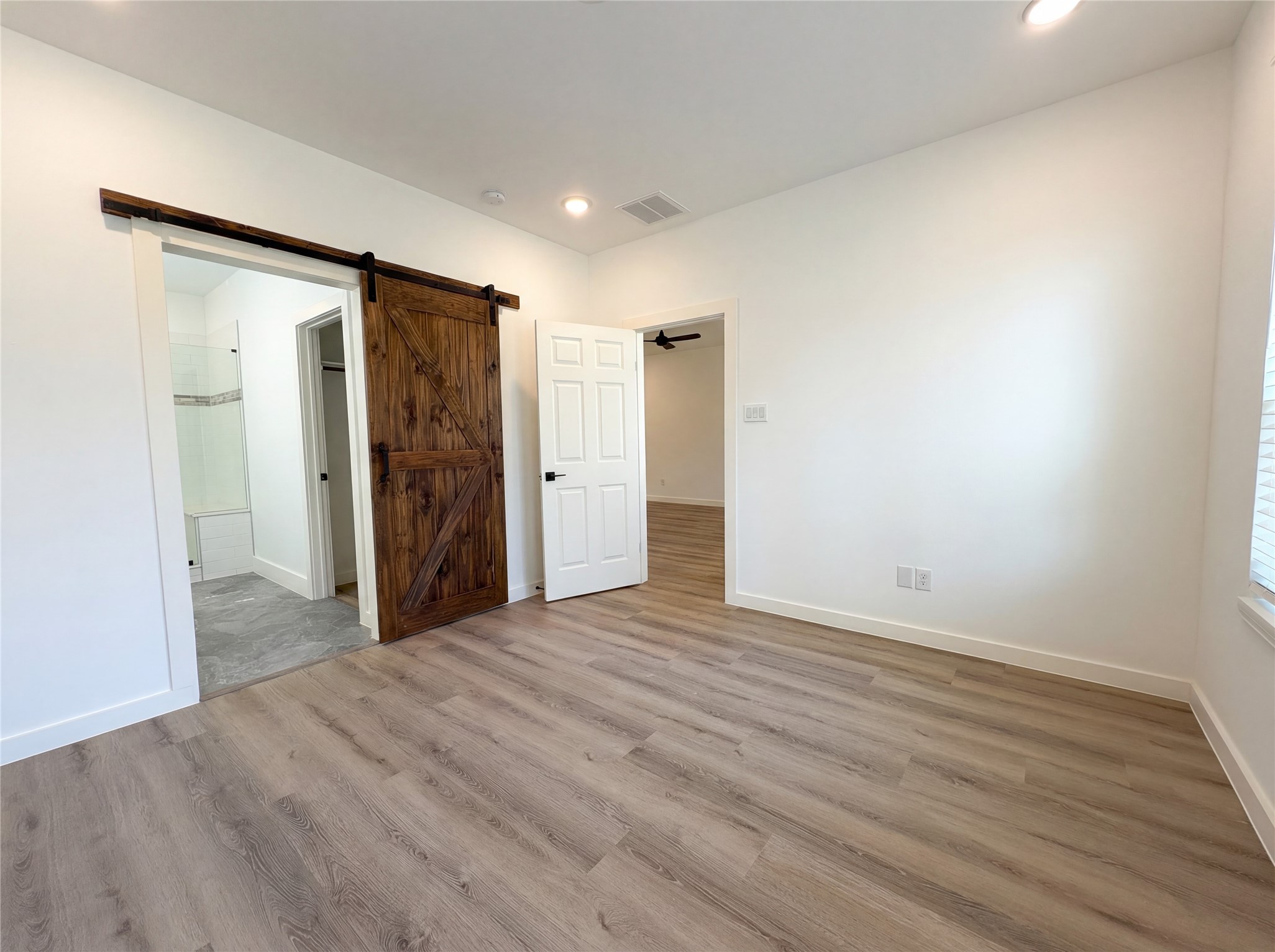 15376 Coaltown Road Willis, TX 77378 - Photo 4 of 17 a view of empty room with wooden floor
