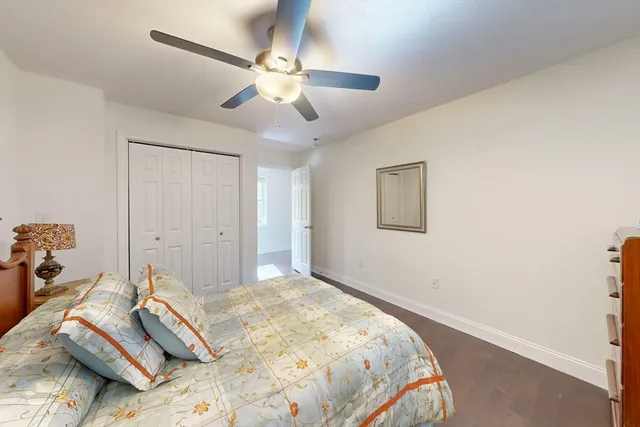 a bedroom with bed and a window