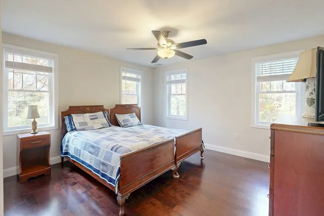 a bedroom with a bed and window