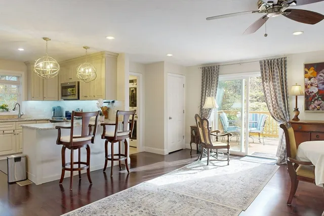 a view of a a dining room with furniture window and outside view