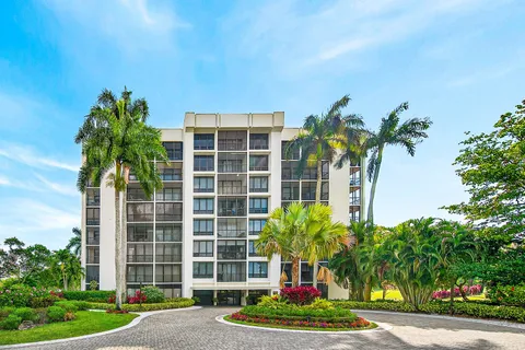 a front view of a building with a garden