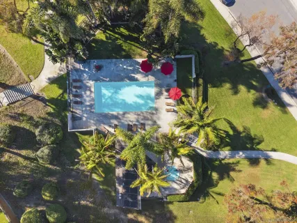 a view of swimming pool with a yard