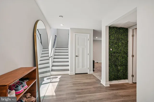 a kitchen with stainless steel appliances a sink a stove top oven a counter space and cabinets