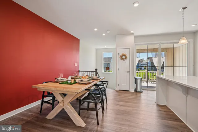 a view of a porch with a table and chairs