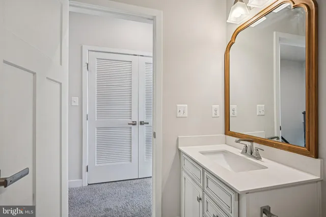 a view of walk in closet with clothes