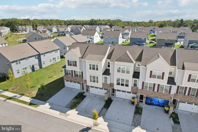an aerial view of a house with a garden