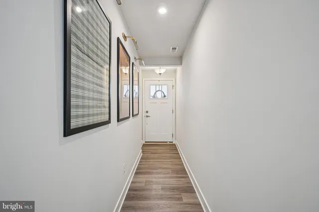 a work room with furniture and a flat screen tv