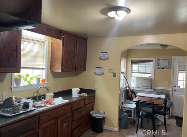 904 Riverside Avenue, Unit 126 Chowchilla, CA 93610 - Photo 3 of 6 a kitchen with a sink cabinets and window
