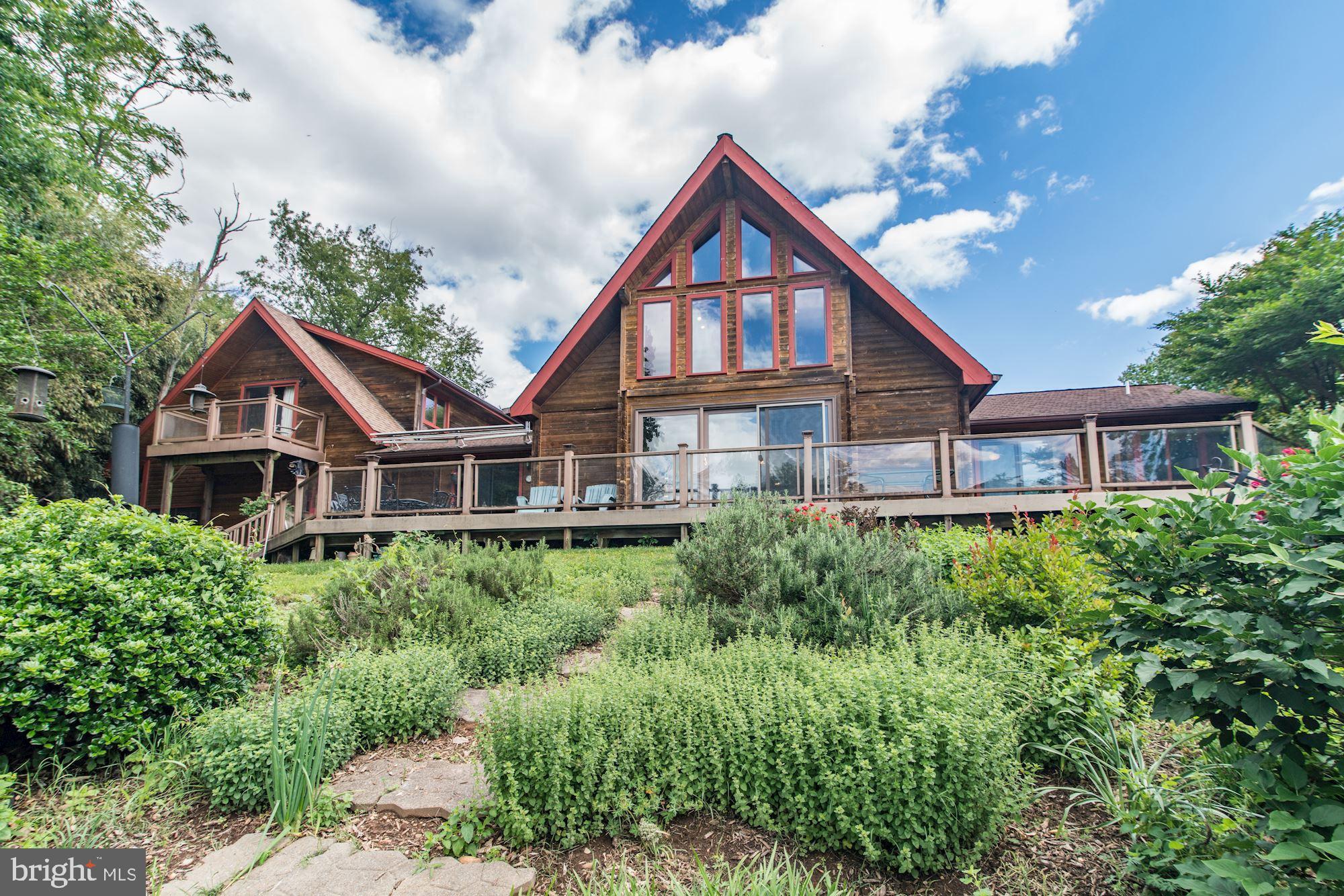 9945 Indian Queen Point Road Fort Washington, MD 20744 - Photo 8 of 88 A frame log home w/ 2 balconies including 2 decks.