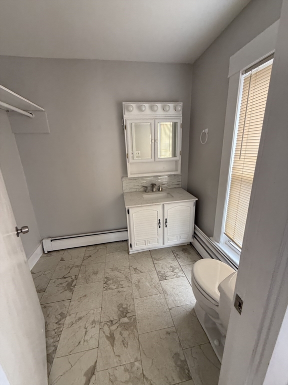 1 Jay Street, Unit 2 Cambridge, MA 02139 - Photo 5 of 14 a view of a bedroom with a bed and a window