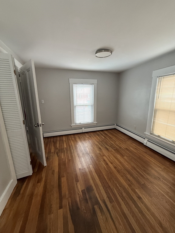 1 Jay Street, Unit 2 Cambridge, MA 02139 - Photo 7 of 14 an empty room with wooden floor and windows
