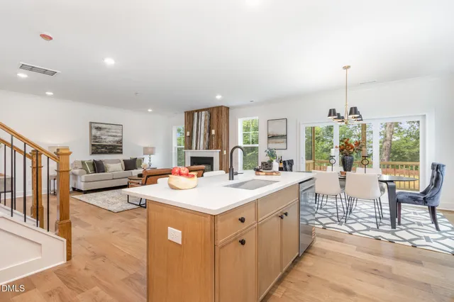 a open kitchen with sink cabinets and wooden floor