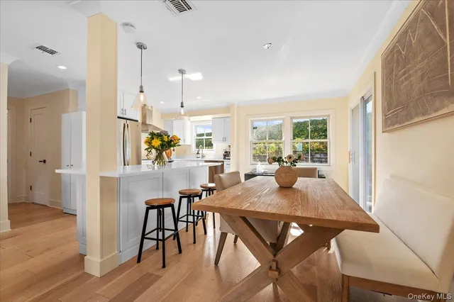 a view of a dining room with furniture window and outside view