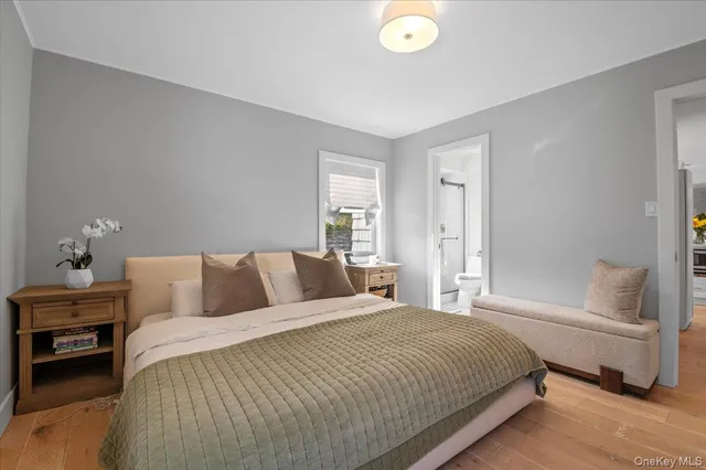 a bedroom with a bed and a lamp