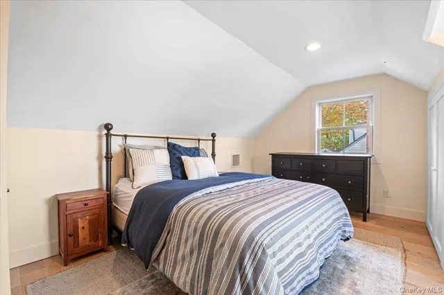 a bedroom with a bed and a closet