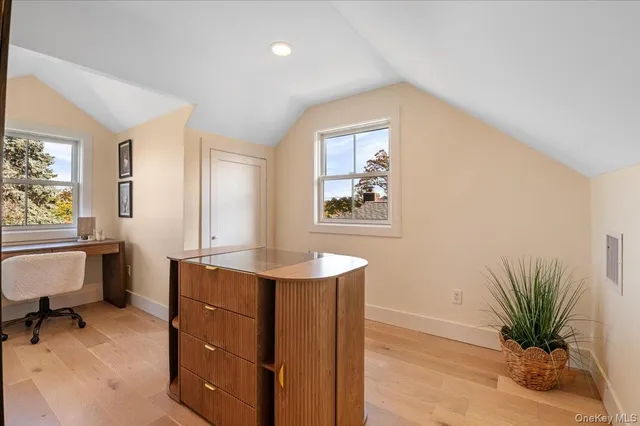 a workspace with furniture and window