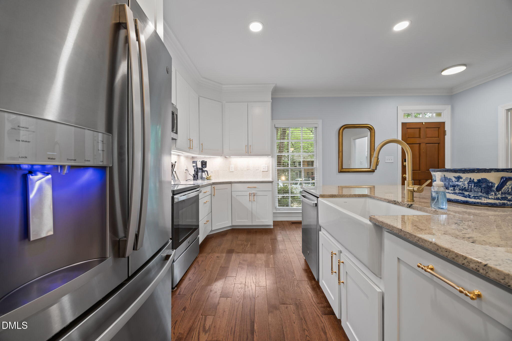 562 Weathergreen Drive Raleigh, NC 27615 - Photo 8 of 47 a kitchen with stainless steel appliances granite countertop a sink stove and refrigerator