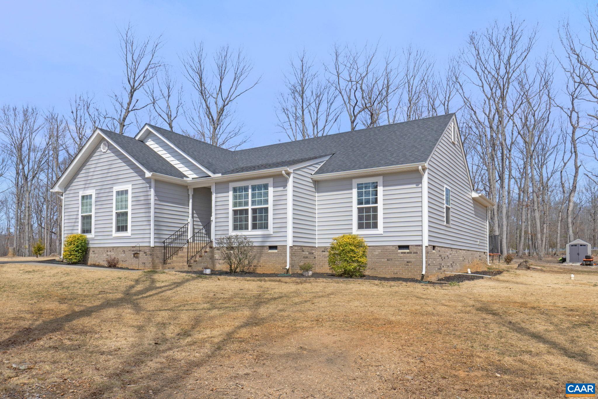 1075 Pine Crest Drive Troy, VA 22974 - Photo 2 of 25 a front view of a house with a yard