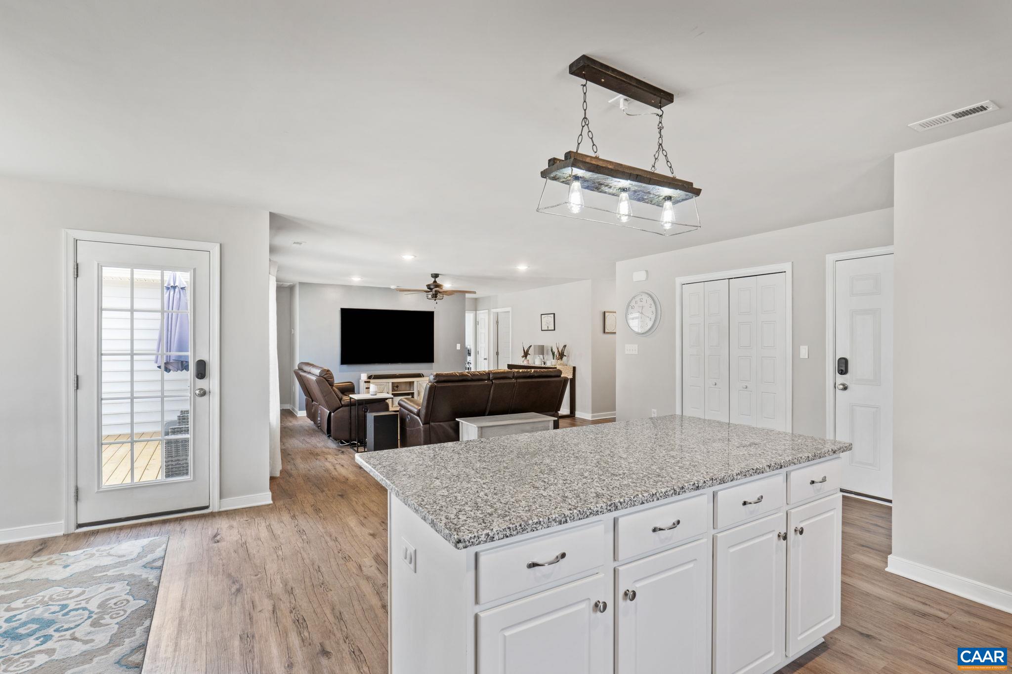 1075 Pine Crest Drive Troy, VA 22974 - Photo 10 of 25 a kitchen with granite countertop a table and chairs in it