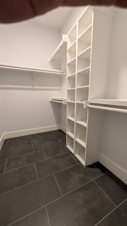 2500 Longview Street, Unit 218 Austin, TX 78705 - Photo 12 of 19 Spacious closet featuring dark tile patterned floors