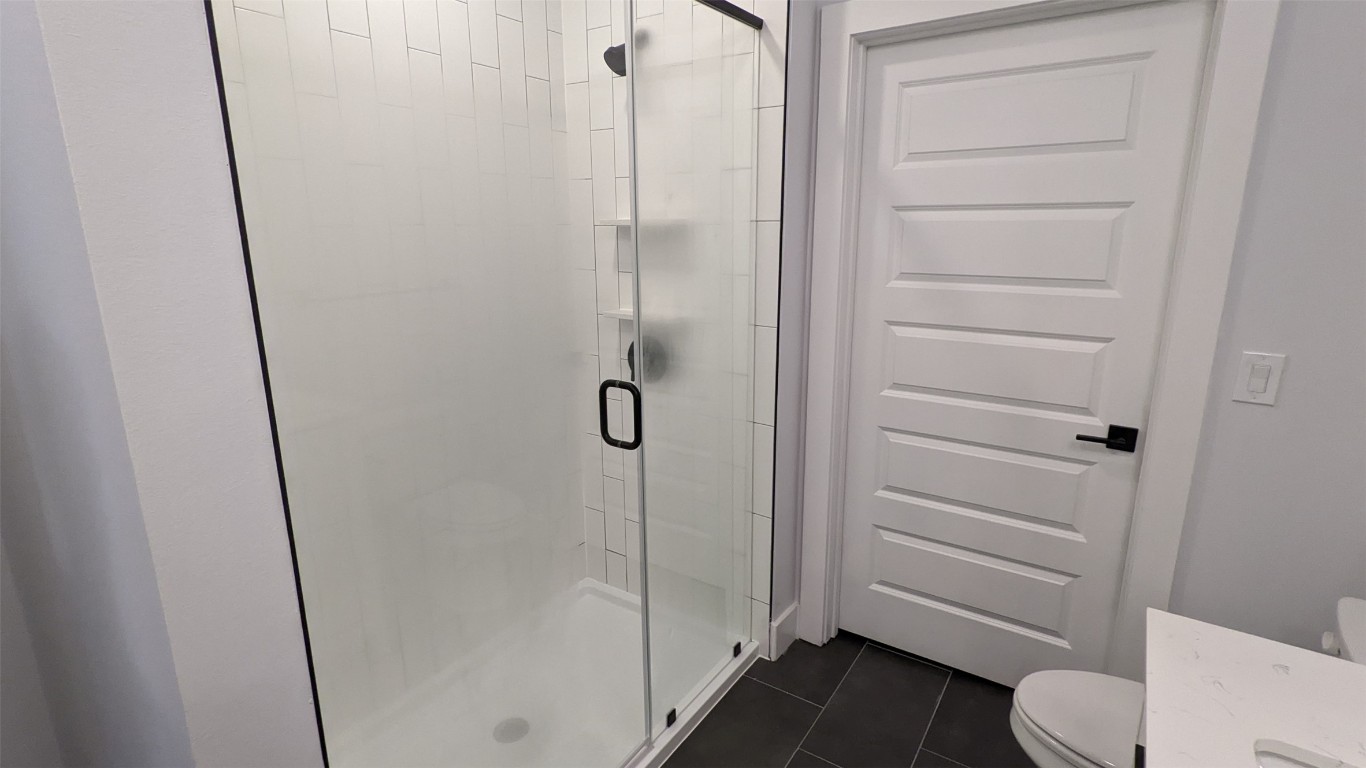 2500 Longview Street, Unit 218 Austin, TX 78705 - Photo 13 of 19 Full bathroom featuring a shower stall and vanity