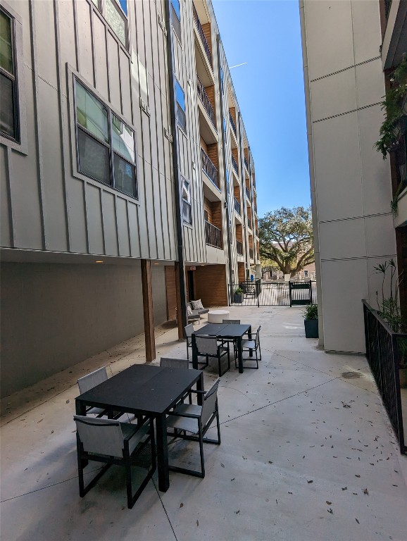 2500 Longview Street, Unit 218 Austin, TX 78705 - Photo 18 of 19 View of community with outdoor dining space and a patio